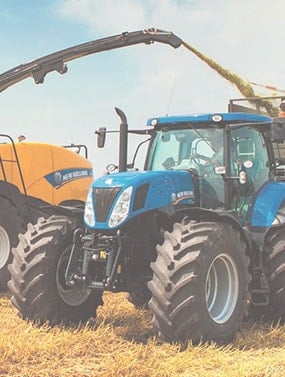 New Holland Combine and Tractor with Grain Wagon